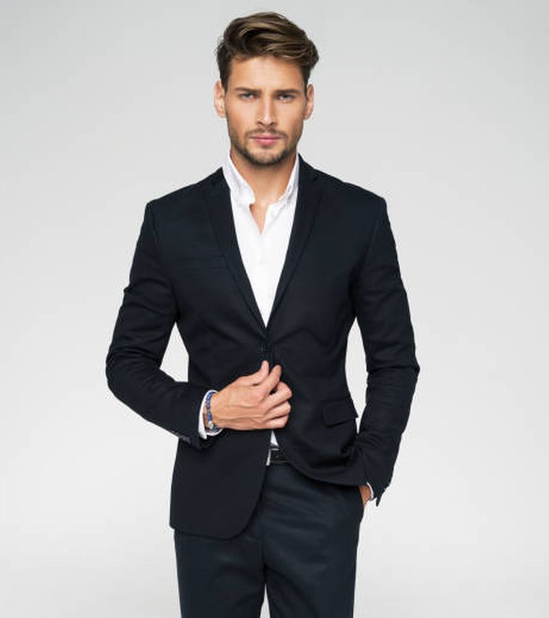 Portrait of handsome man in black suit
